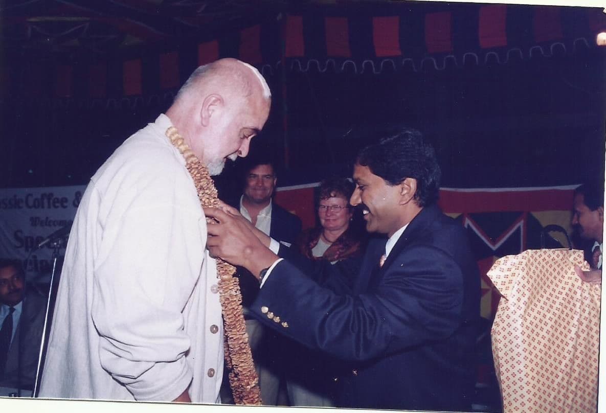 A guest being welcomed with a garland
