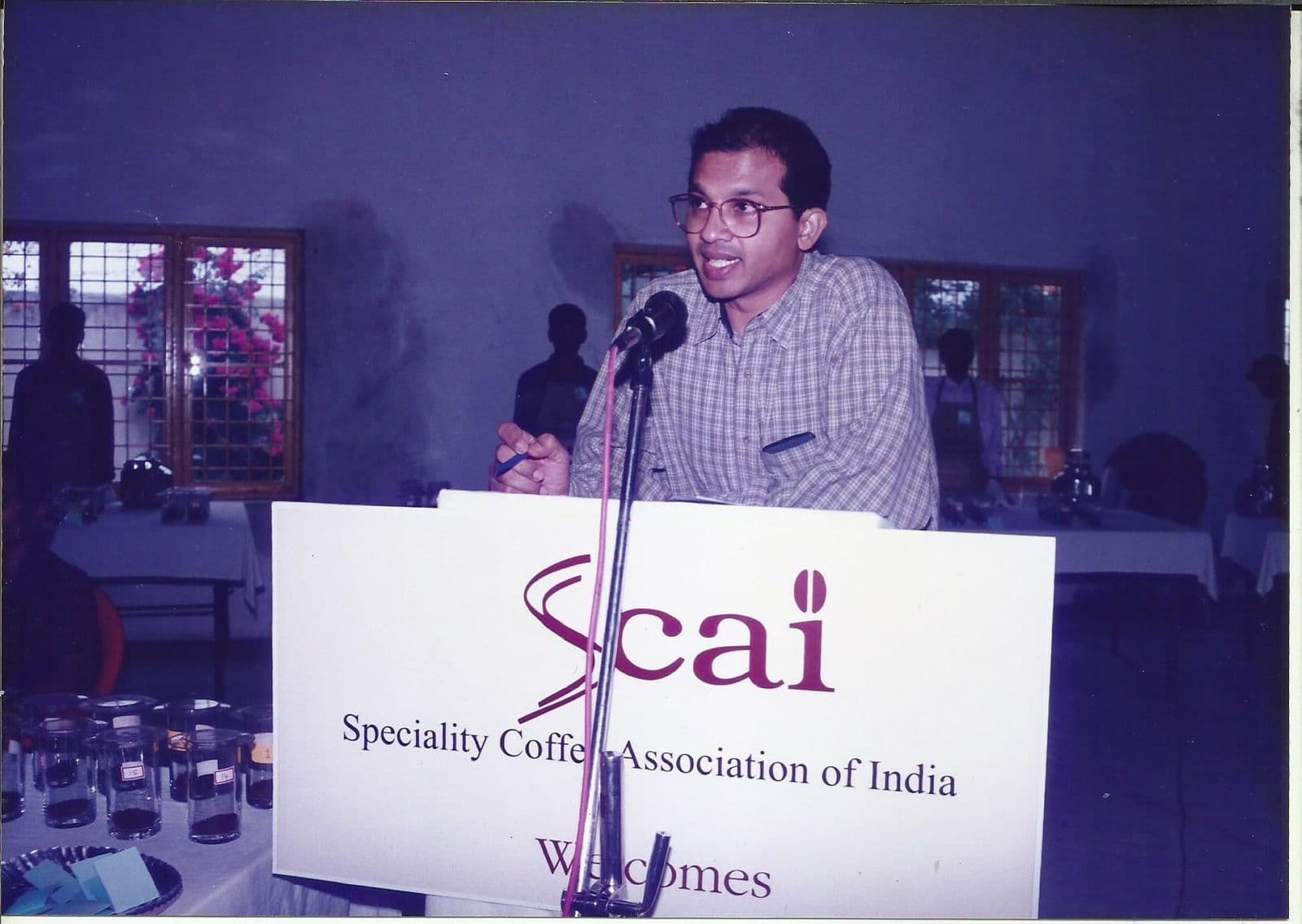 Speaker addressing members from the SCAI podium