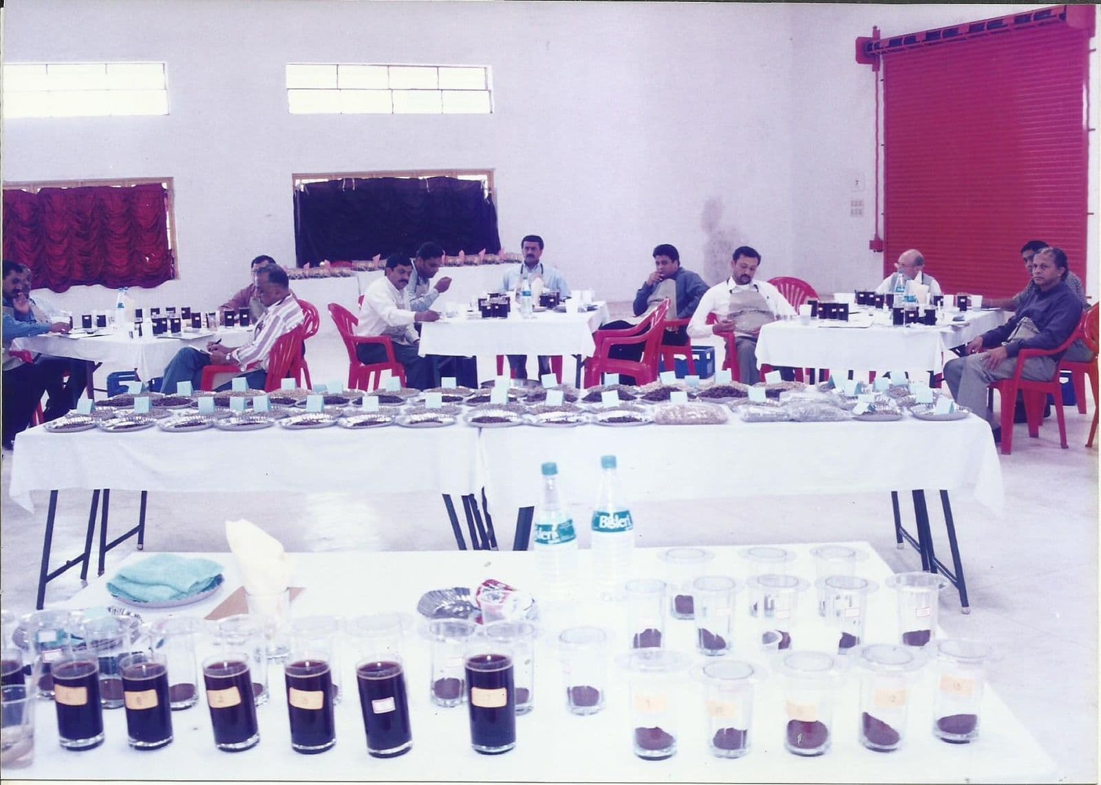 Cupping room laid out with rows of coffee samples
