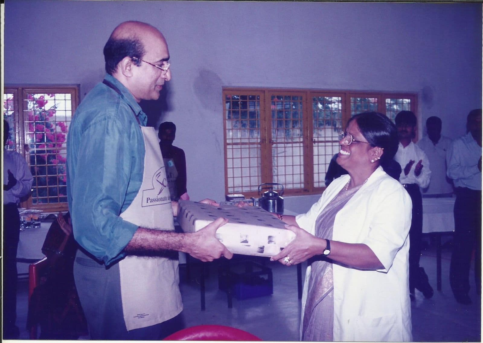 A member receiving a gift at a cupping session