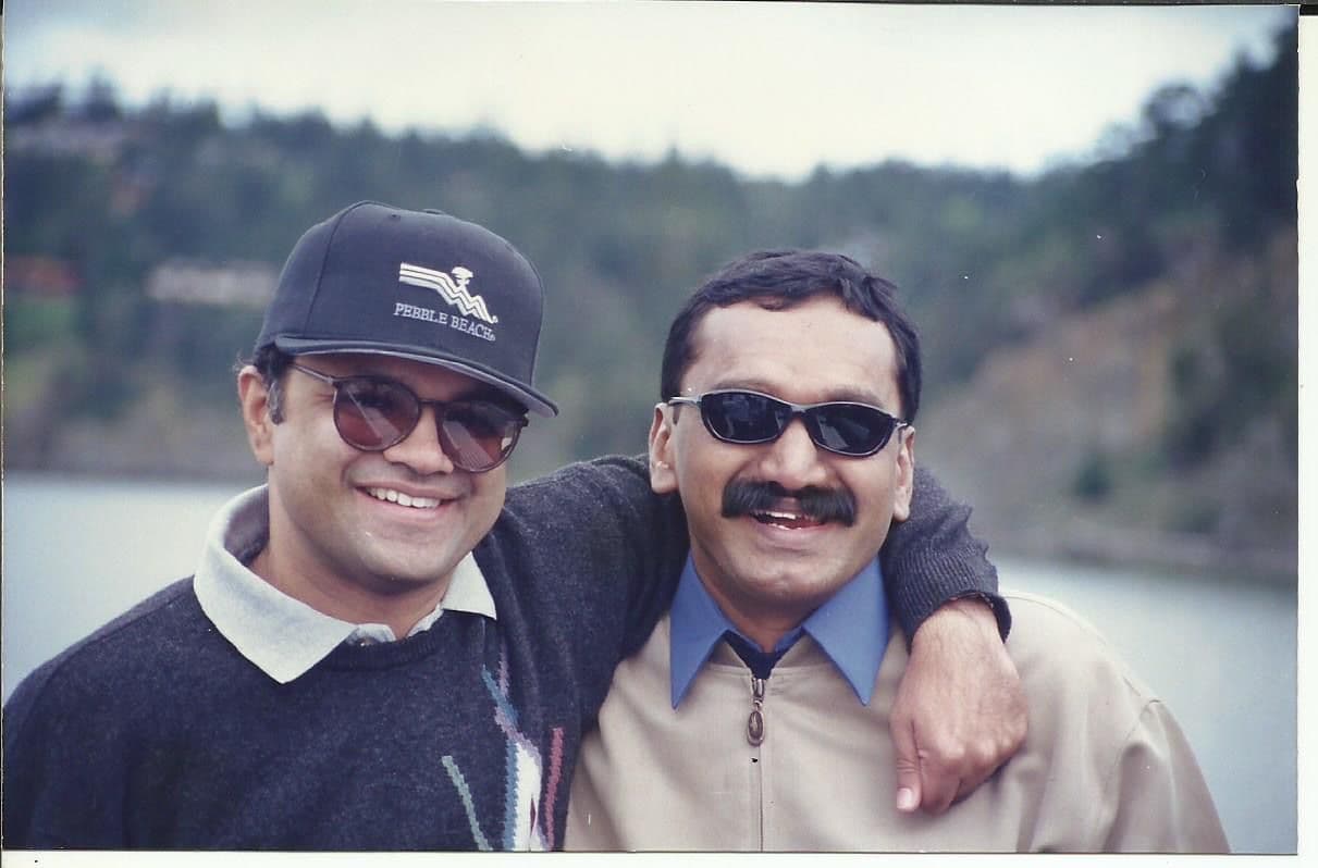Two members smiling outdoors