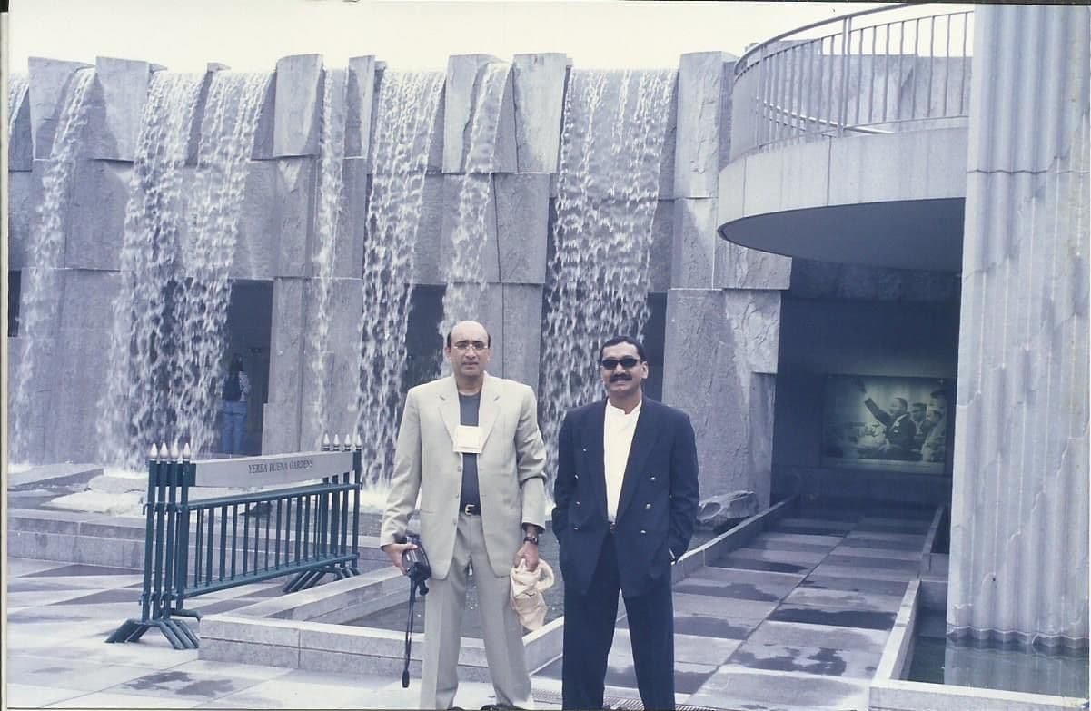 Two members outside a modern building