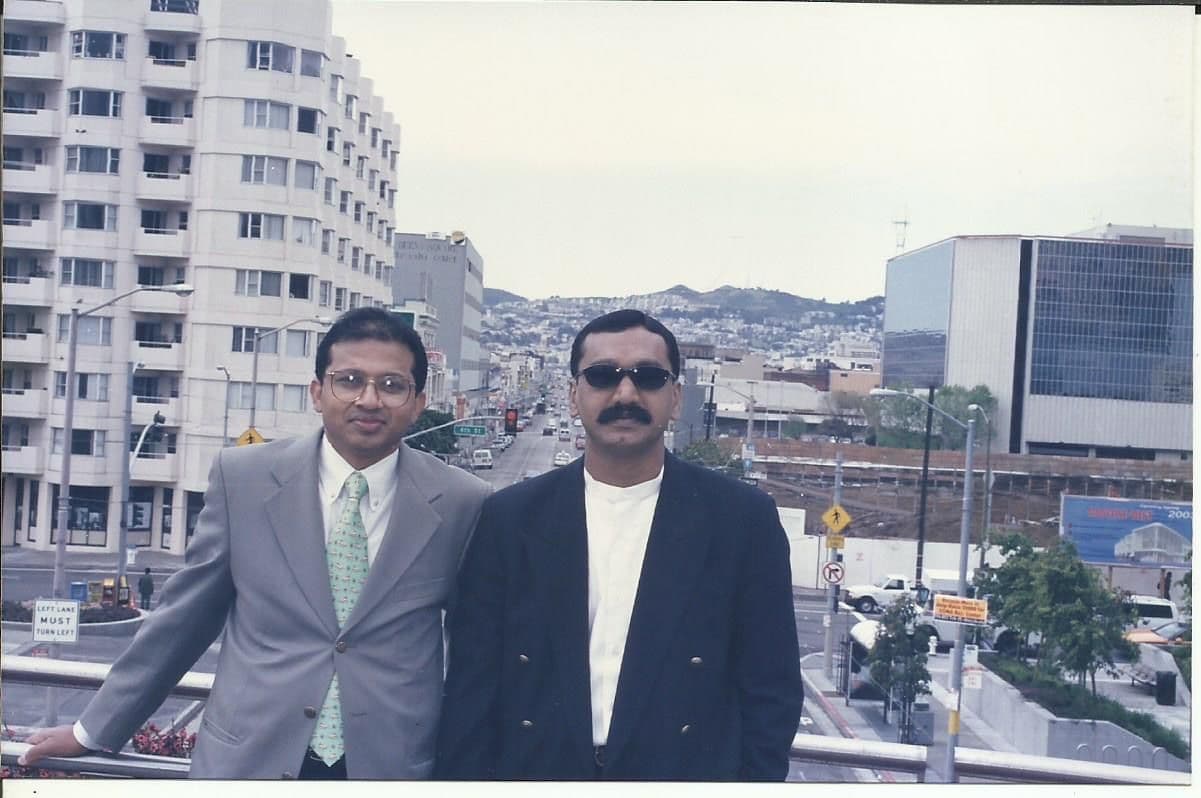 Two members on a terrace overlooking a city